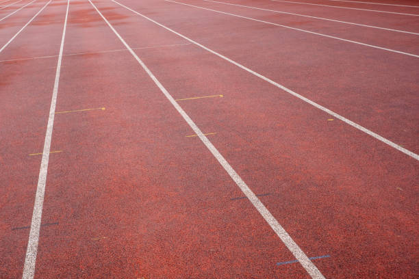 istock wet synthetic track in the athletics stadium 2148927191