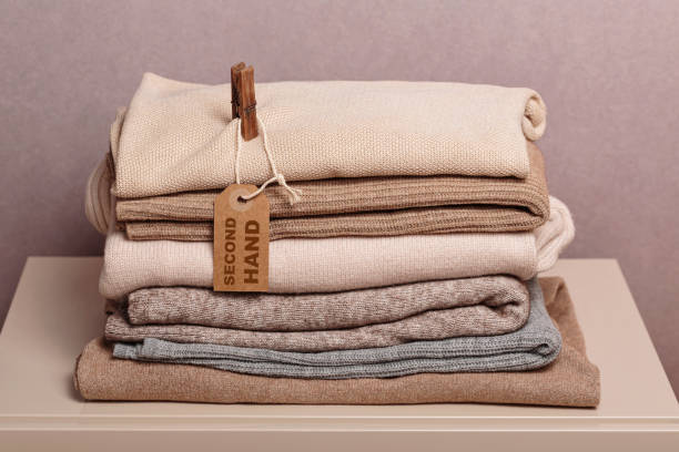 istock Stack of second hand clothes, ready to give away, used wardrobe 2148927666