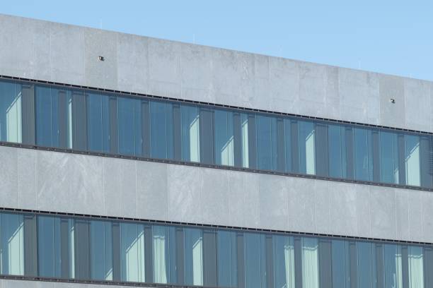 The Swiss Re - headquarters are located in Zurich (switzerland). Main Office Building opened 2017. The image shows the office building exterior (close-up) during summer season.