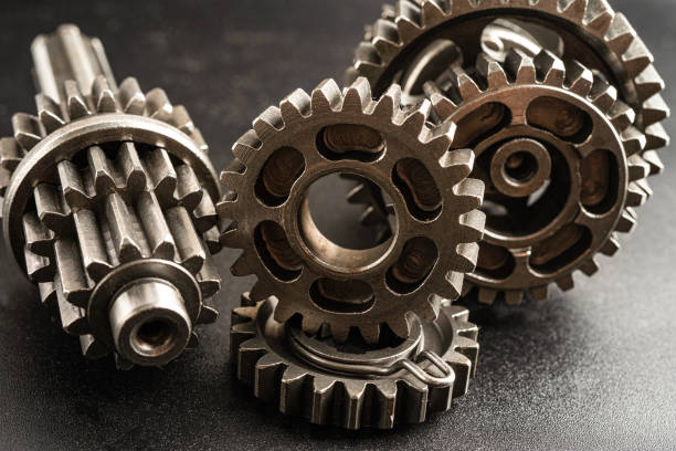 istock Gear and cogs wheels, clock mechanism, brass metal engine industrial. 2148929818