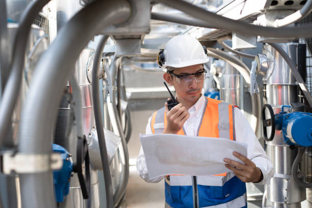 istock Engineers are inspecting a large building or industrial facility's cooling system for the air conditioning on rooftop building 2148931643