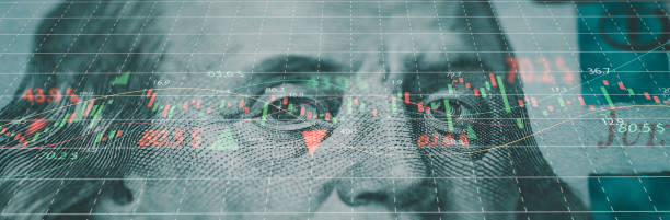 istock Closeup Benjamin Franklin face on USD dollar banknote with stock market chart graph for currency exchange and global trade forex concept. 2148931955