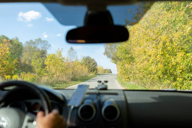 istock A man in a car checks the road using a navigator from a mobile phone 2148933200