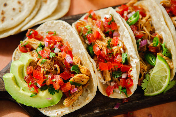 istock Close-up of mexican taco shells with avocado and lemon slice on table 2148934514