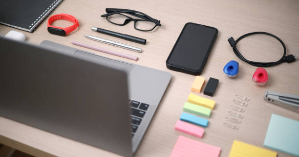 istock Top view of office table desk with notebook, computer, paper, pencil, eyeglasses the accessories for office work. 2148934855