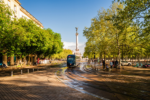 Bordeaux, France - April 9th, 2024:  Girondins Monument and tram railway road on Place des Quinconces; Bordeaux