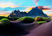 Vestrahorn Scenic landscape with most beautiful mountains Vestrahorn on the Stokksnes peninsula and cozy lagoon with green grass on the sand dunes at sunset in Iceland. Exotic countries. Amazing places.