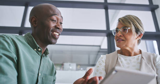 istock Tablet, conversation and business people in office for teamwork with research for creative project. Collaboration, planning and designers working on digital technology in workplace boardroom. 2148941319