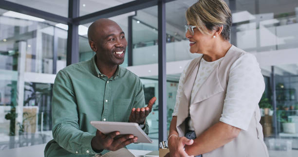 istock Meeting, client and business people with tablet in office for planning, discussion and b2b networking. Corporate, insurance company and man and woman on digital tech for sign up, feedback and review 2148941336