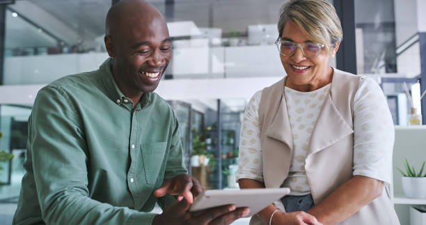 istock Office, people and happy with tablet for teamwork or collaboration as employee with training. Support, help and learning for technology with mobile app or information for company growth and smile 2148941337
