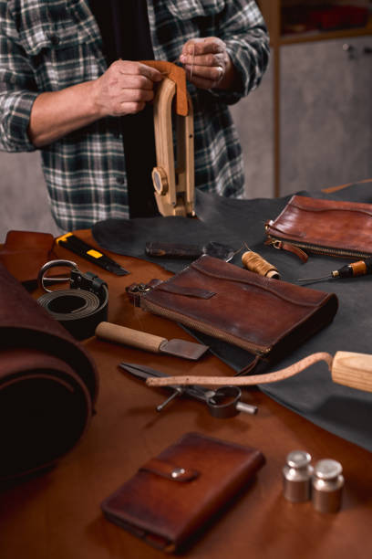 istock focus on handmade orange leather wallet 2148941606