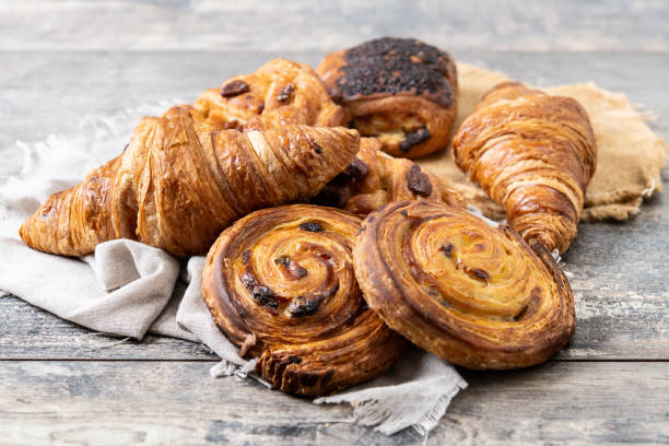 istock Set of bakery pastries on wooden table 2148941792