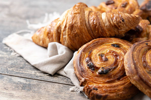 istock Set of bakery pastries on wooden table 2148941978