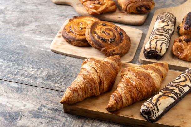 istock Set of bakery pastries on wooden table 2148941998