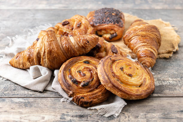 istock Set of bakery pastries on wooden table 2148942011