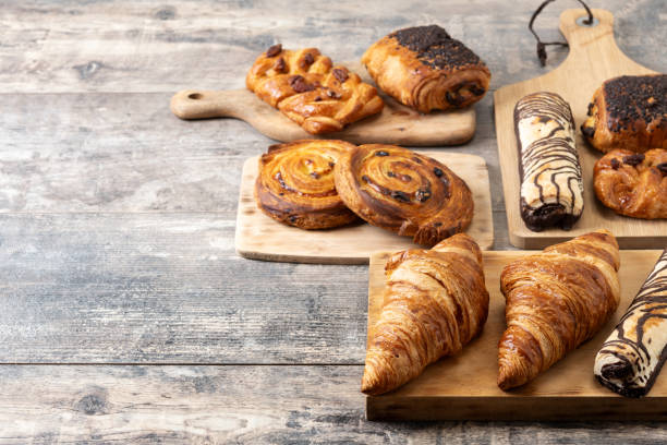 istock Set of bakery pastries on wooden table 2148942074
