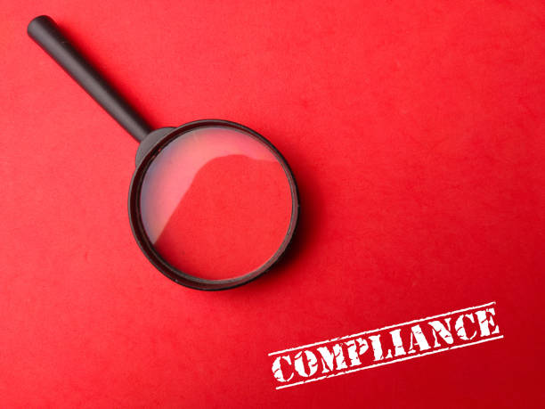 istock Magnifying glass with the word COMPLIANCE 2148942470