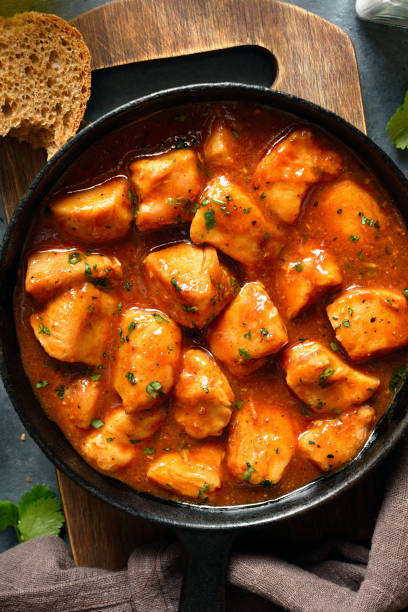 istock Sweet and spicy chicken bites with sauce in cast iron pan 2148943847