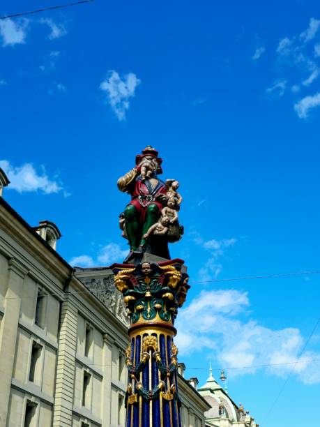 The Kindlifresserbrunnenis a painted stone fountain at the Kornhausplatz (Granary Place) in Bern. It is one of the Old City of Bern's fountains from the 16th century. The image shows the foutain parially, captured during spring season.