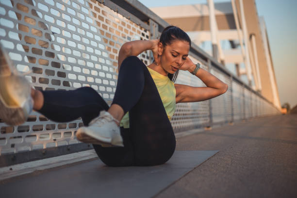 istock Beautiful young woman getting her abs nice and trim 2148946235