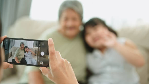 istock Taking a photo elderly with grandkid. 2148946346