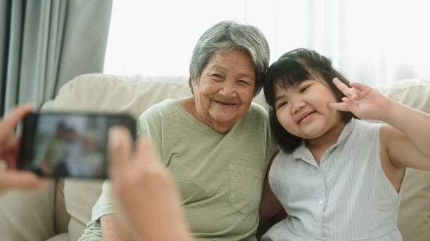 istock Taking a photo elderly with grandkid. 2148946348