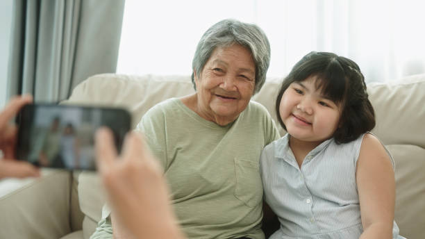 istock Taking a photo elderly with grandkid. 2148946365