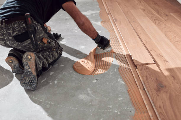 istock Professional handyman installing laminate flooring in a new apartment. 2148947238