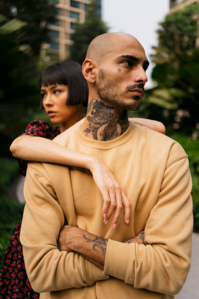 istock Thoughtful young couple standing together in the park 2148947718