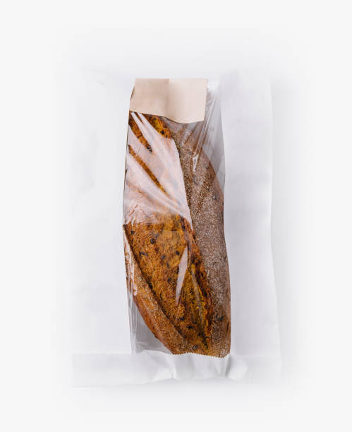 istock Artisan bread in paper bag isolated on white 2148947732