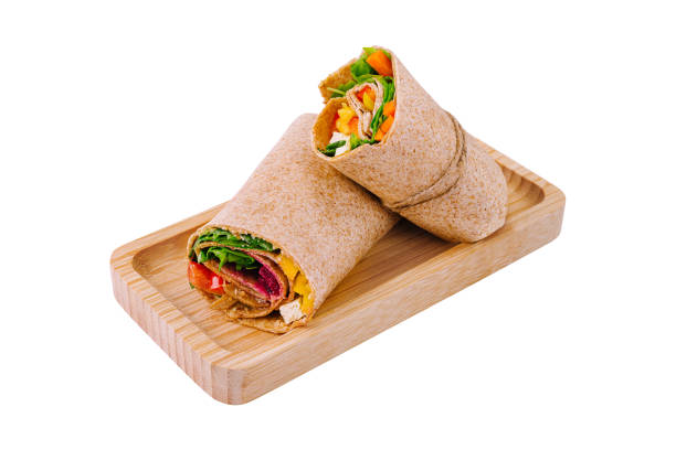 istock Fresh chicken wrap sandwich on wooden board 2148947958