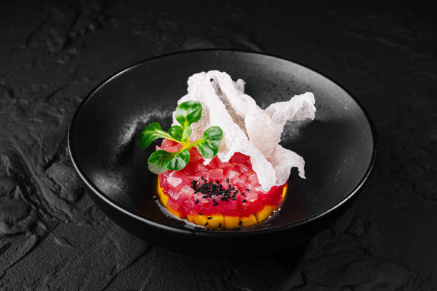 istock Exquisite gourmet tuna tartare with avocado and crispy bread 2148948090