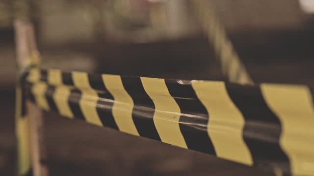 Close-up of a yellow and black plastic tape