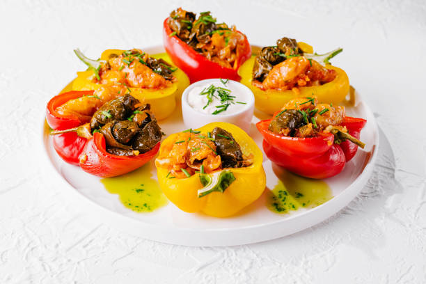 istock Colorful stuffed bell peppers on white plate 2148948887