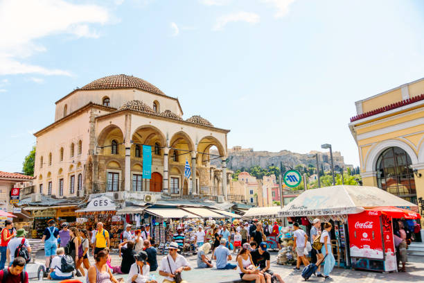 Experience the vibrant pulse of Athens at Monastiraki Square on a sunny day as crowds gather amidst the historic charm of this bustling hub. Against a backdrop of iconic landmarks and colorful facades, locals and visitors immerse themselves in the lively atmosphere. From the aroma of street food to the sounds of lively conversations, every corner of the square exudes an irresistible energy. As sunlight bathes the scene in warmth, Monastiraki Square becomes a quintessential destination, where culture, history, and community converge in a vibrant celebration of Athenian life.