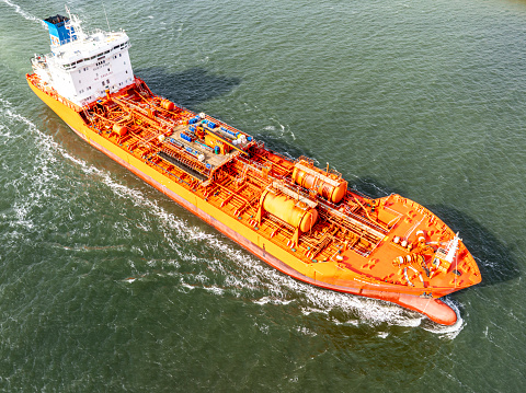 Oil tanker ship arriving in the port of IJmuiden, geteway to the port of Amsterdam seen from above. Bellis Shipping B.V. is a Tank Farm Storage Company and Shipping Company for petroleum and petrochemical products