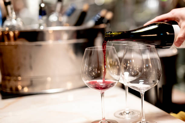 istock Pouring  redcwine at luxury restaurant and luxuryy tabel settings 2148950747