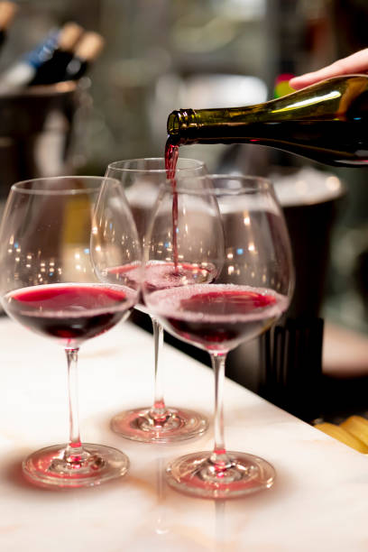 istock Pouring  redcwine at luxury restaurant and luxuryy tabel settings 2148950811