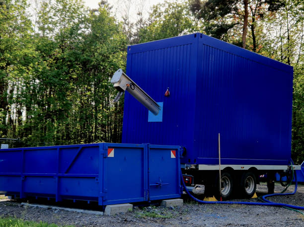 istock sedimentation sludge conveyor belt. sorts gross dirt and throws it into the container. dumping of hazardous waste in the automatic line of the wastewater treatment plant 2148951740