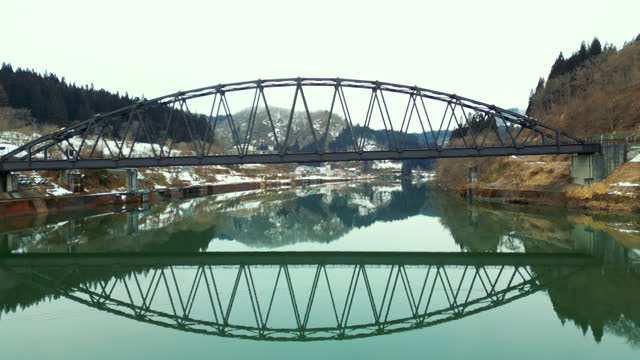 Aerial view of Tadami river bridge in winter