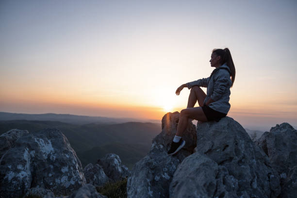 istock Female Hiker Enjoying Sunset from Mountain Top 2148953090