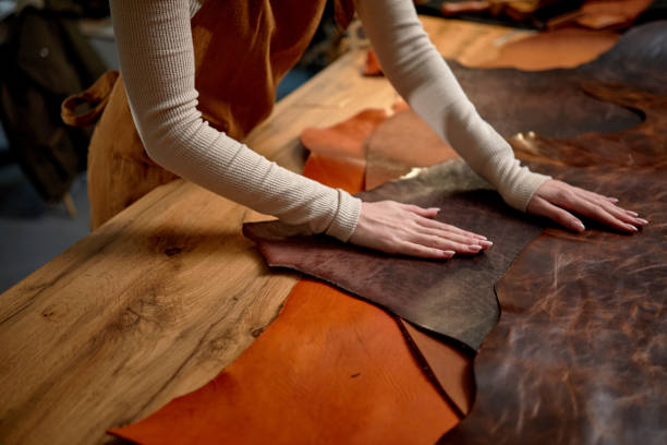 female hands cleaning the surface of leather