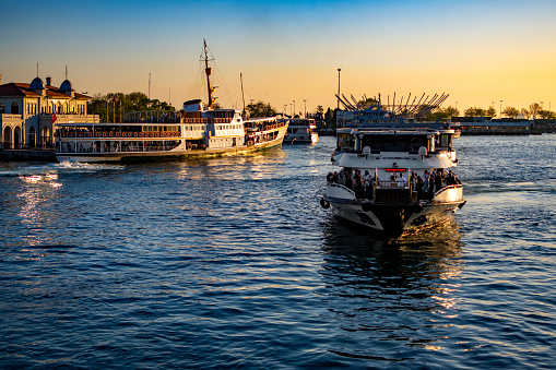Istanbul, Turkey : April 14, 2024: Tourist boat on the Bosphorus of the Istanbul, Turkey, Kadikoy Harbour