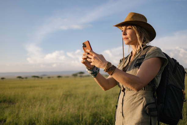 istock Female tourist using mobile phone in national reserve. 2148955856