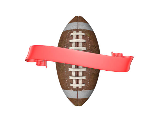 American football ready to be kicked on a sports field on a hot sunny summer day.