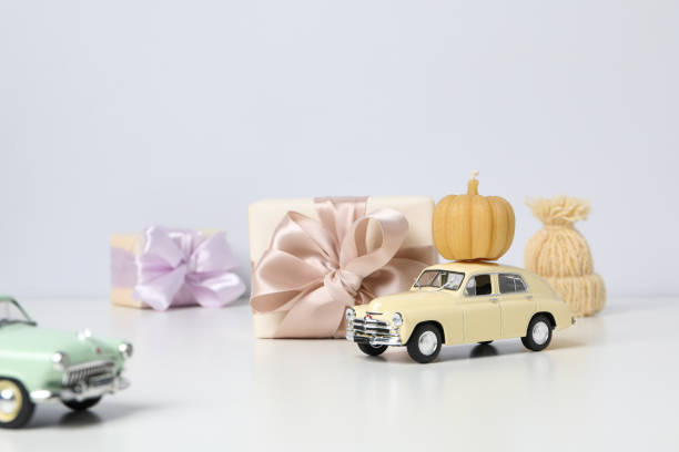 Autumn or fall travel and vacation concept with car