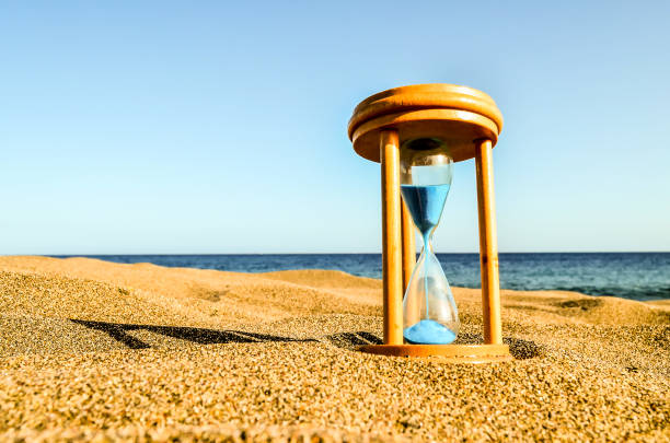 istock A wooden sand timer is sitting on the beach 2148960391