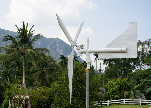 Wind turbines are installed in white farms to tell wind direction.
