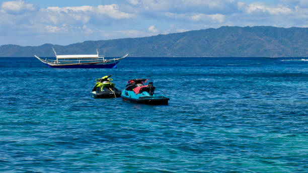 istock Jet skis and motor boat at sea. 2148962428
