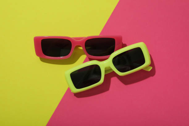 istock A pair of sunglasses on a bright, colorful background 2148963745